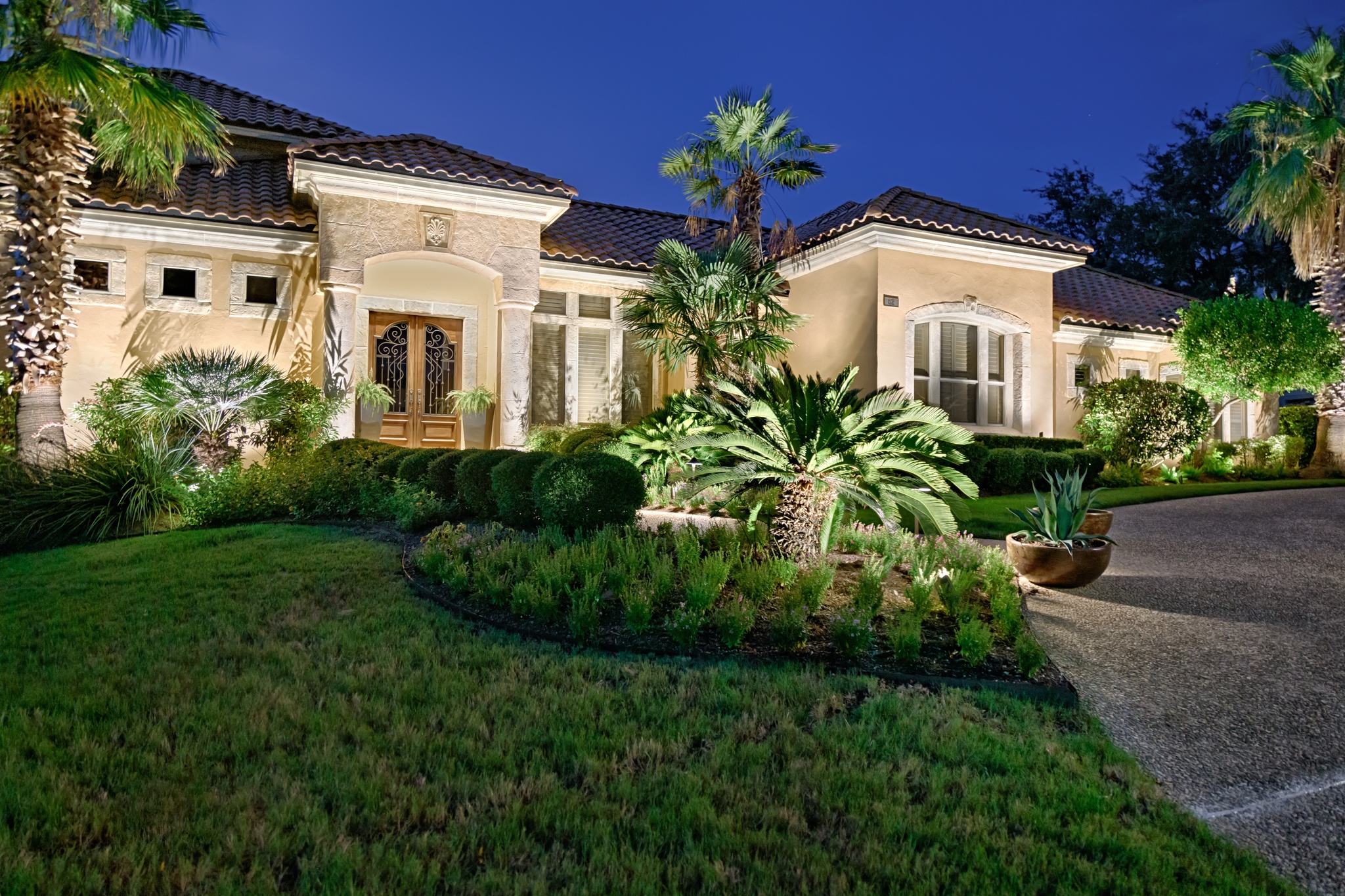 home with outdoor landscape lighting by the perfect light