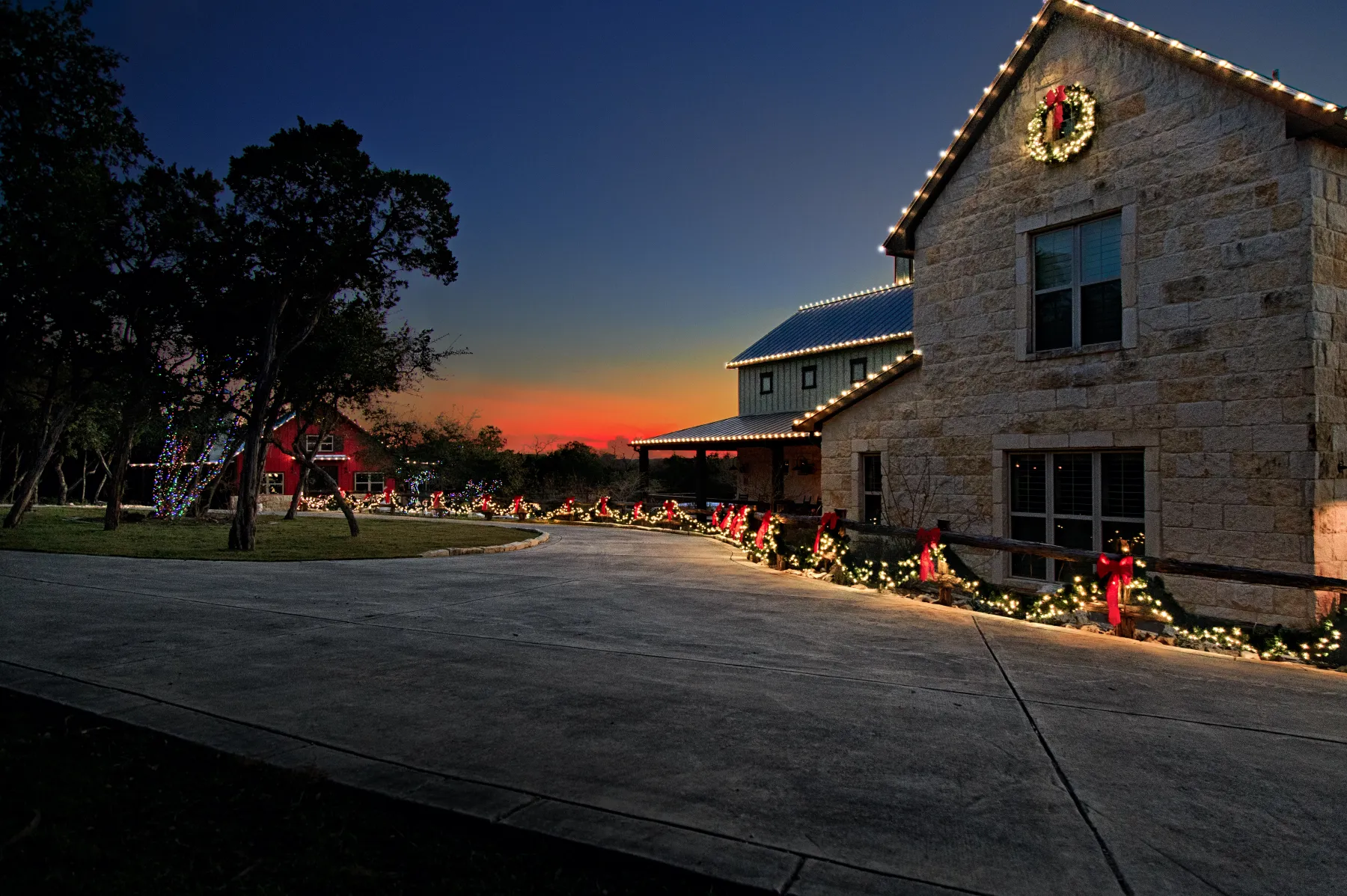 Barn venue commercial Christmas lighting with festive swag