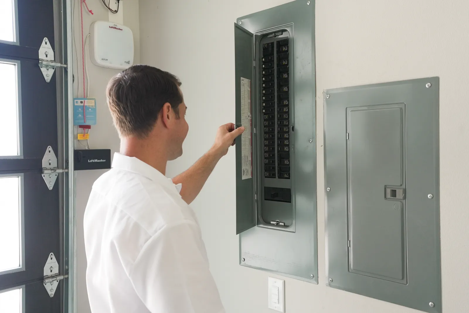 Licensed electrician completing a service call