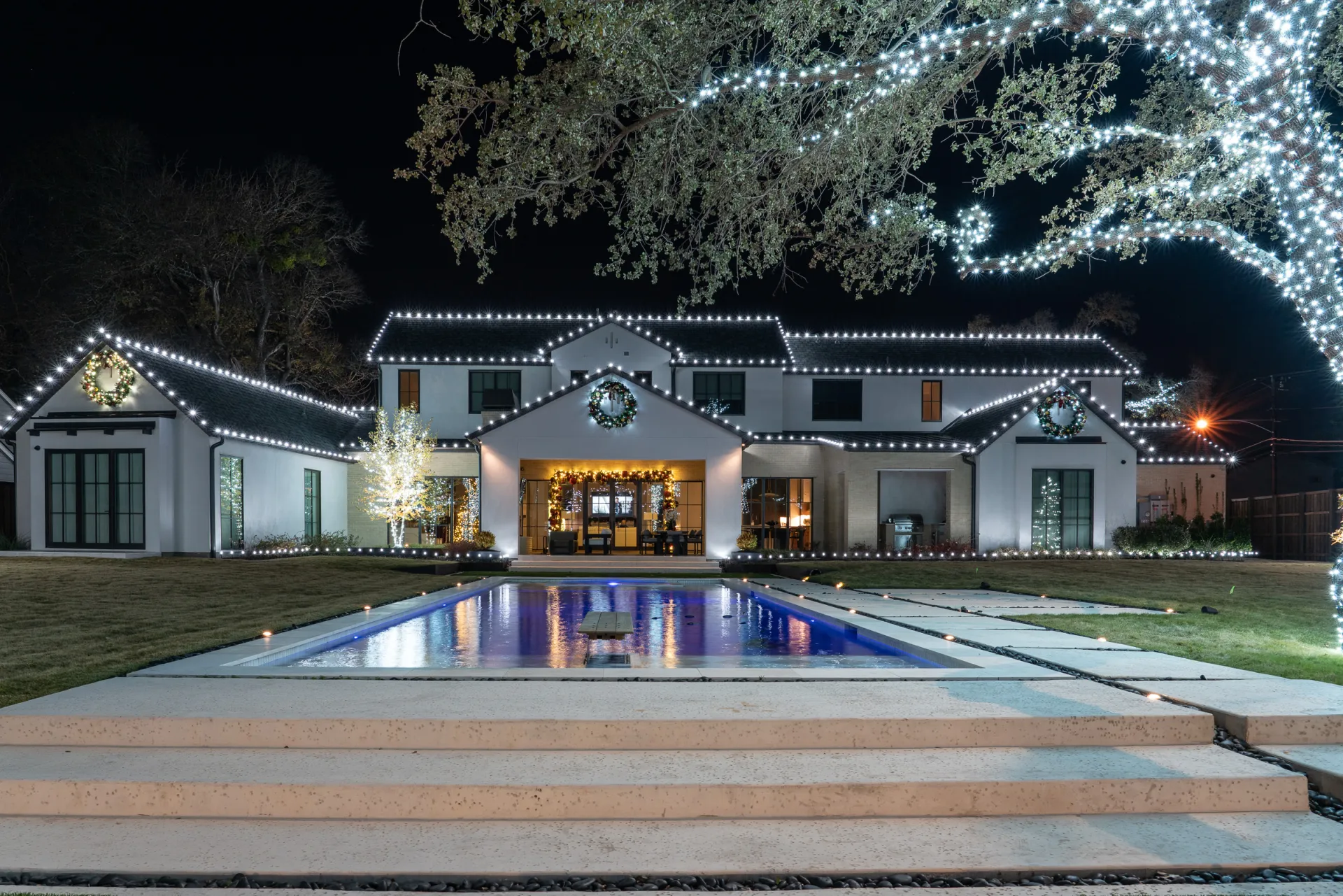 Texas home at night with professional Christmas lighting by The Perfect Light