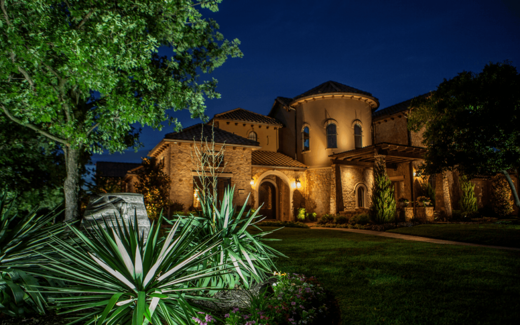 landscape lighting on home and front garden by The Perfect Light