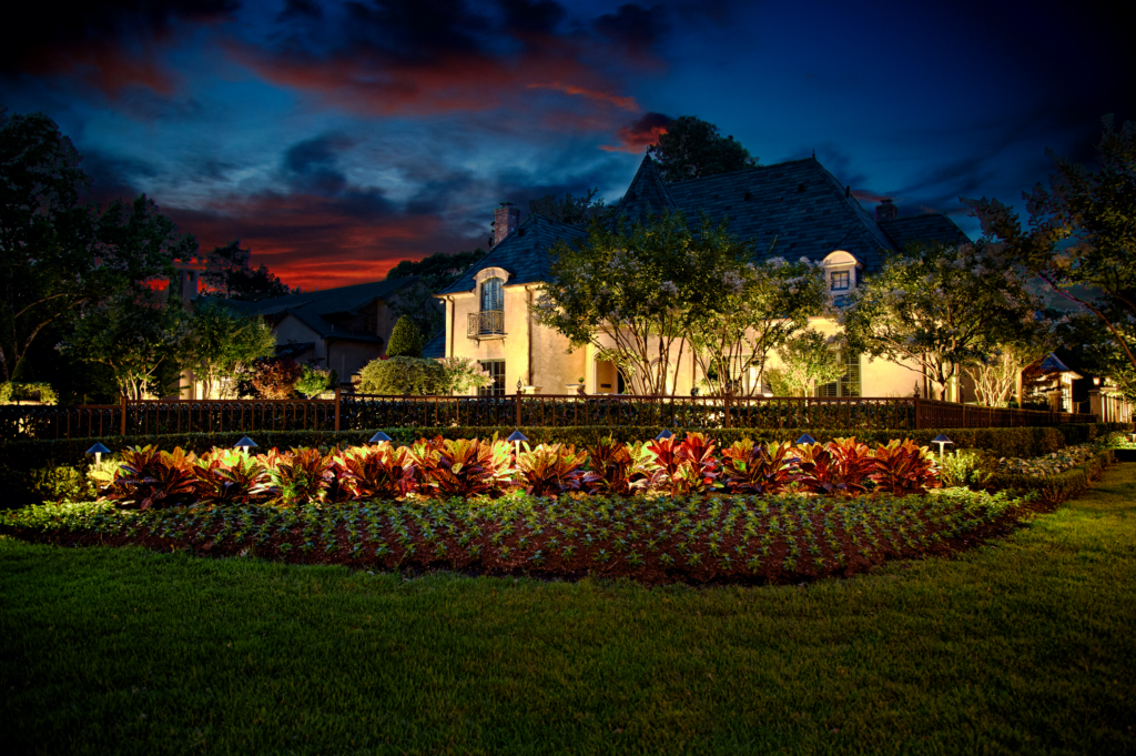landscape lighting in garden and on home by The Perfect Light