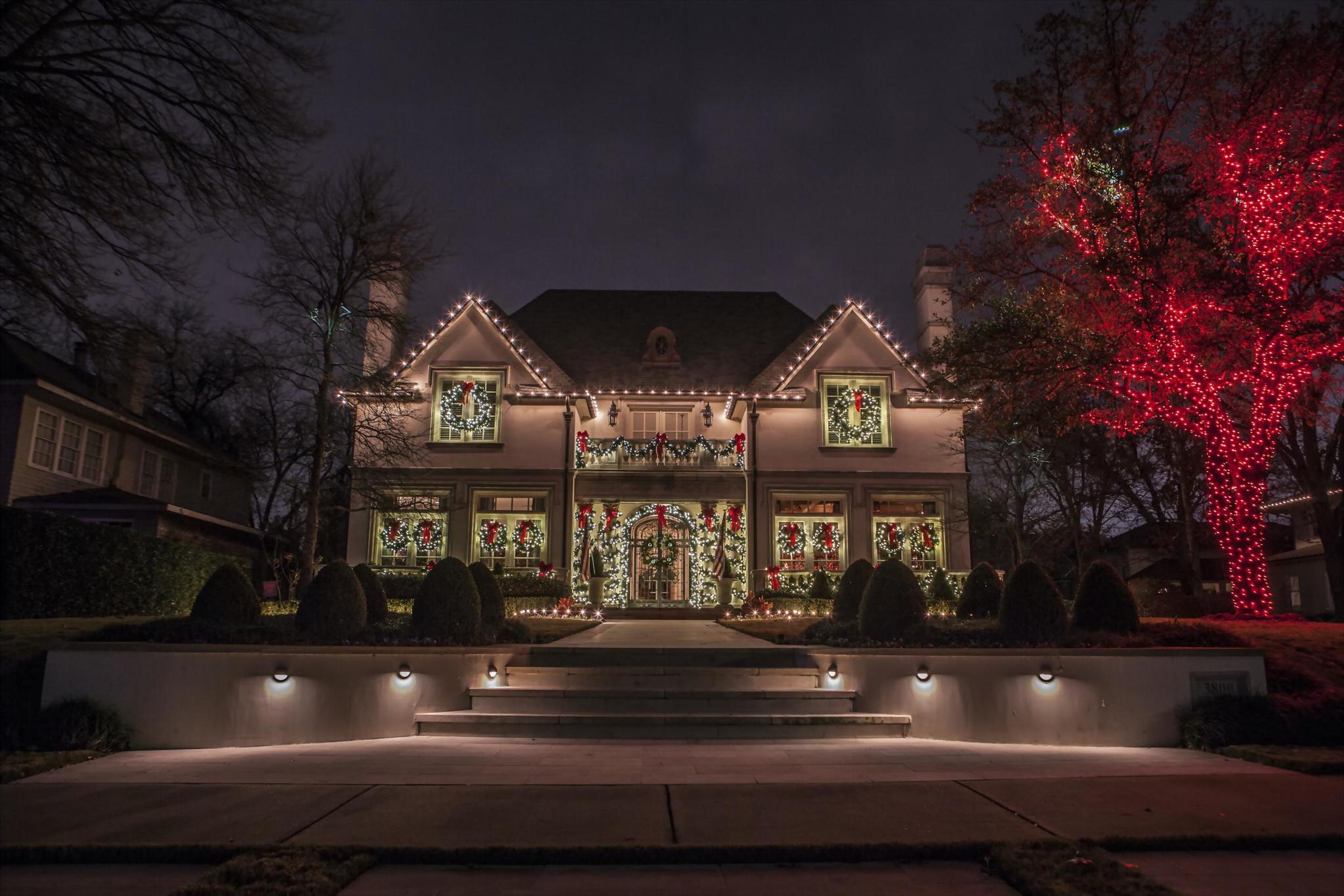 home adorned with holiday lights by The Perfect Light