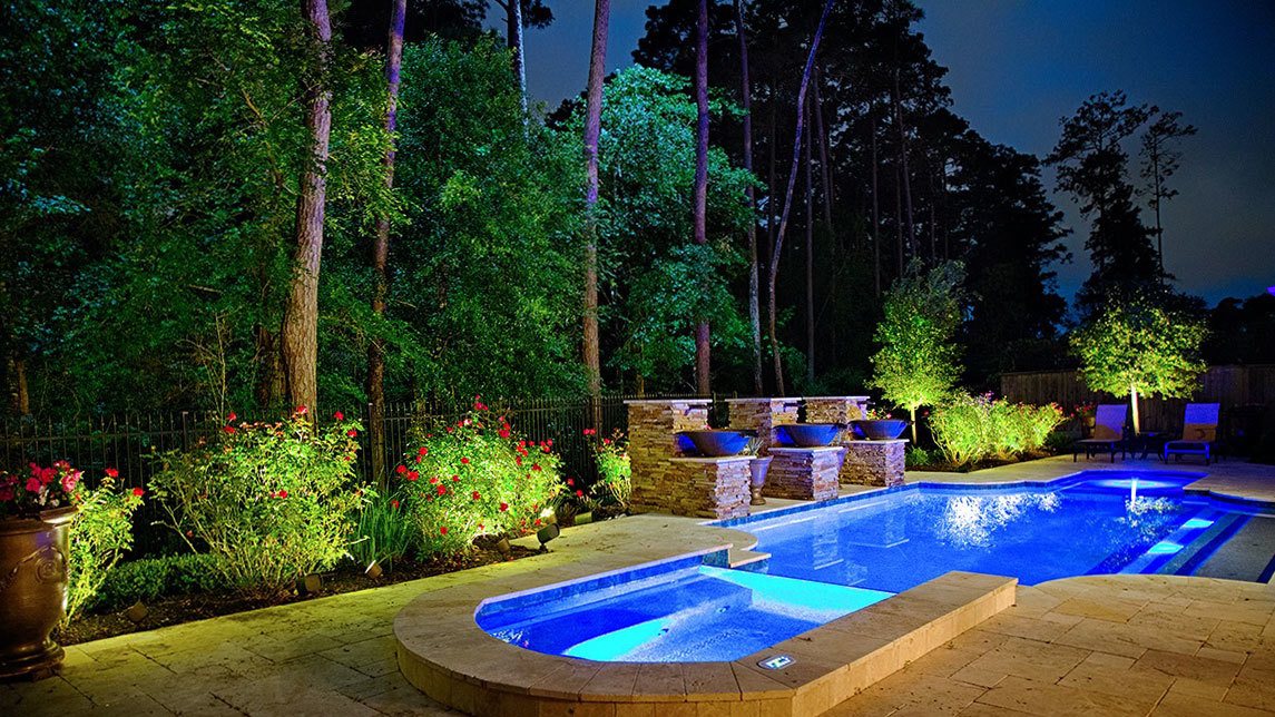 outdoor landscape lighting on texas yard with pool