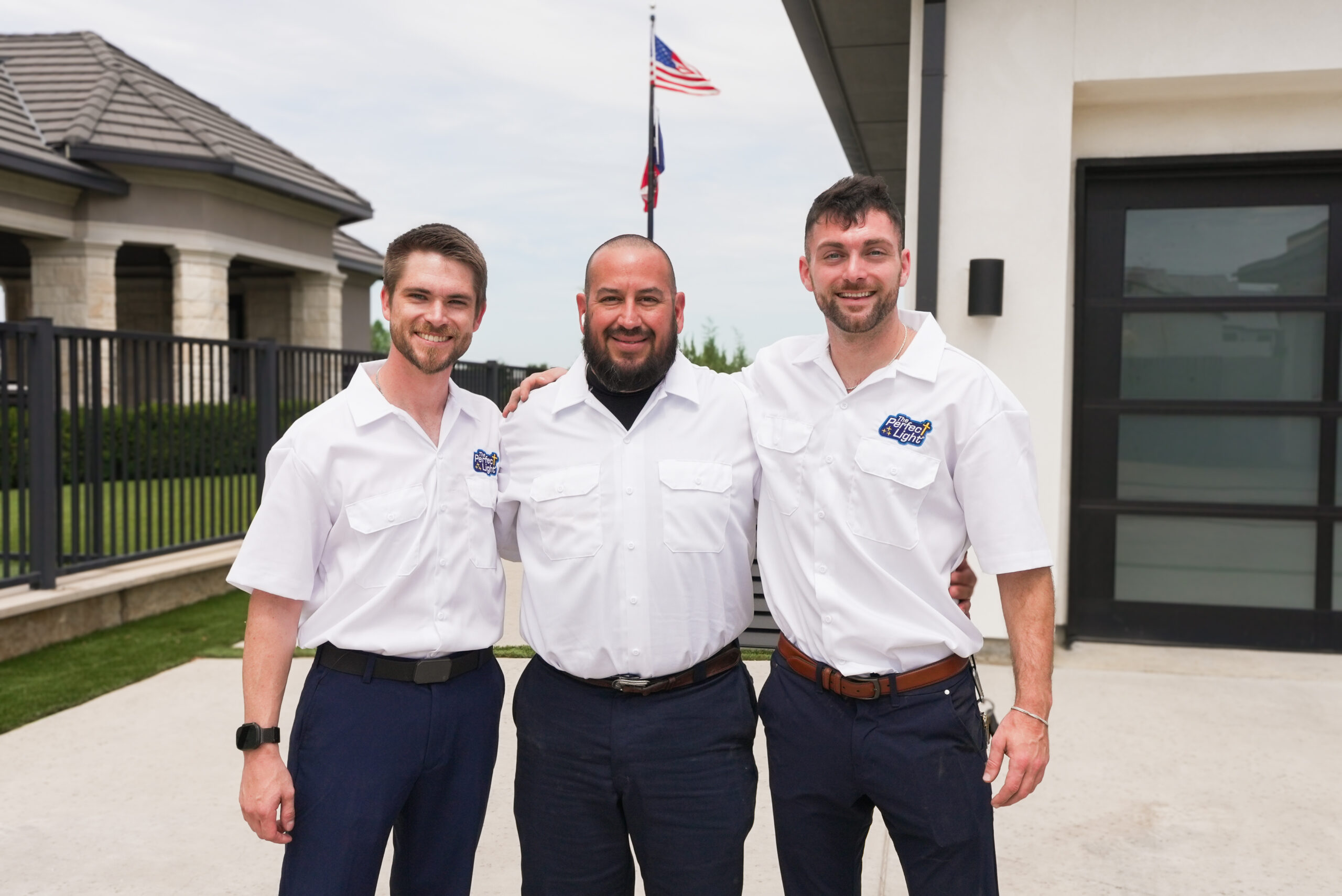 The Perfect Light electrical technicians standing together outside a home in Texas